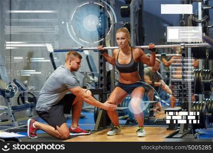 sport, fitness, teamwork, bodybuilding and people concept - young woman and personal trainer with barbell flexing muscles in gym over virtual charts. man and woman with barbell flexing muscles in gym