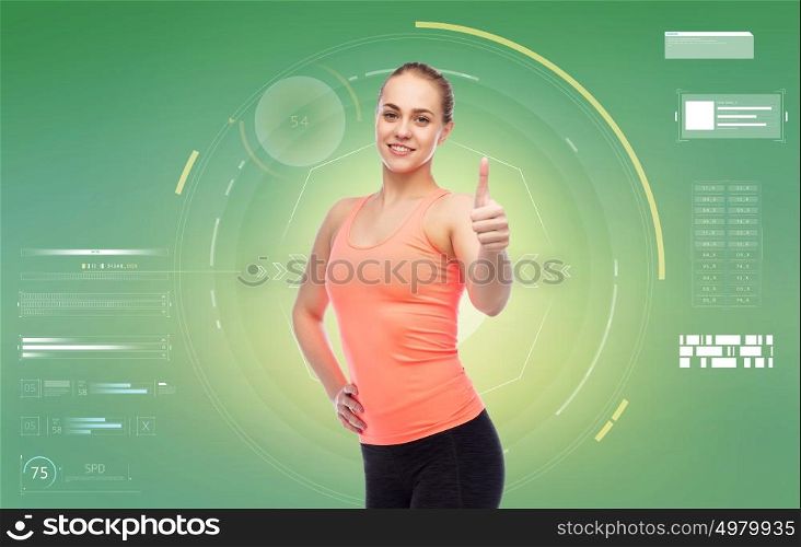sport, fitness, technology and people concept - happy smiling sportive young woman showing thumbs up over green background. happy sportive young woman showing thumbs up