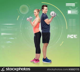 sport, fitness, technology and people concept - happy sportive man and woman with dumbbells flexing muscles over green background. sportive man and woman with dumbbells