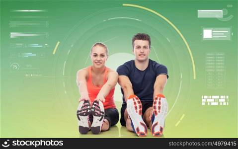 sport, fitness, technology and people concept - happy sportive man and woman over green background. happy sportive man and woman