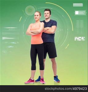 sport, fitness, technology and people concept - happy sportive man and woman over green background. happy sportive man and woman