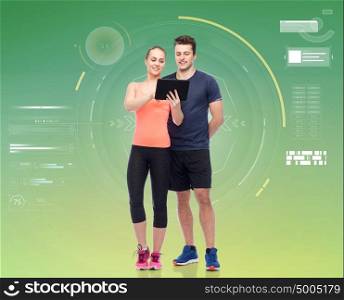 sport, fitness, technology and people concept - happy sportive man and woman with tablet pc computer. happy sportive man and woman with tablet pc