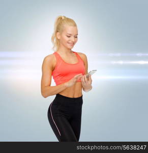 sport, fitness, technology, internet and healthcare concept - smiling sporty woman with smartphone