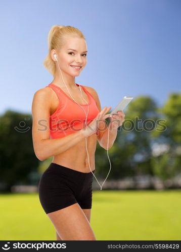 sport, fitness, technology, internet and healthcare - smiling sporty woman with smartphone and earphones