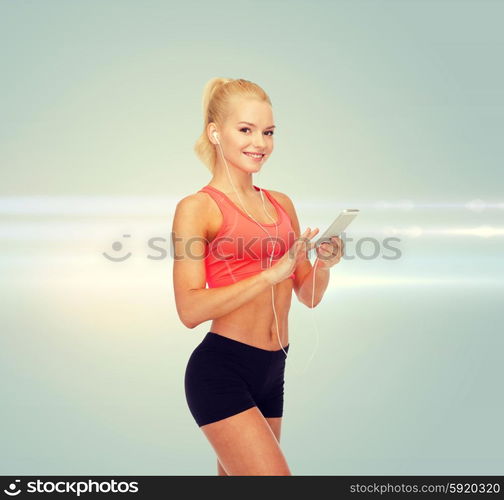 sport, fitness, technology, internet and healthcare - smiling sporty woman with smartphone and earphones