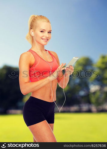 sport, fitness, technology, internet and healthcare - smiling sporty woman with smartphone and earphones