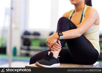 sport, fitness, technology, lifestyle and people concept - close up of woman with heart rate tracker in gym. close up of woman with heart rate tracker in gym