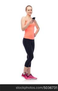 sport, fitness, technology, lifestyle and people concept - happy smiling sportive young woman with smartphone. happy smiling sportive young woman with smartphone
