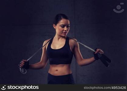 sport, fitness, training, stamina and people concept - young sporty woman with jumping rope. young sporty woman with jumping rope
