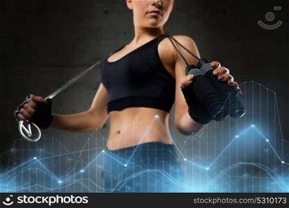 sport, fitness, training, stamina and people concept - young sporty woman with jumping rope. sporty woman with jumping rope
