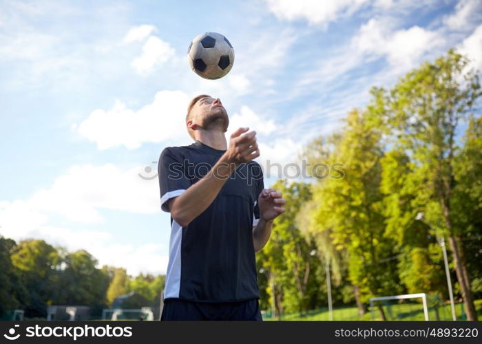 sport, football and people - soccer player playing and juggling ball using header technique on field