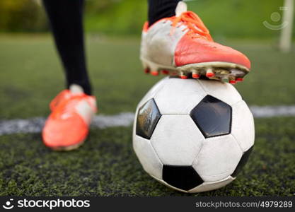 sport, football and people - soccer player playing with ball on field. soccer player playing with ball on football field