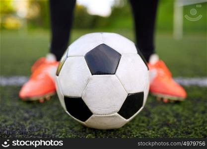 sport, football and people - soccer player playing with ball on field. soccer player playing with ball on football field
