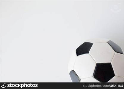 sport, football and sports equipment concept - close up of soccer ball over white background from top