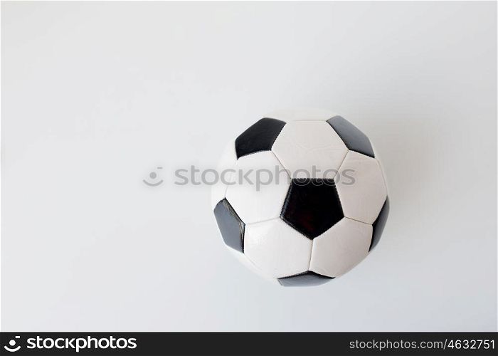 sport, football and sports equipment concept - close up of soccer ball over white background from top