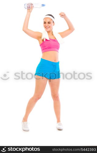 Sport girl with towel over her head and bottle of water rejoicing success isolated on white&#xA;
