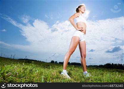 Sport girl. Young beautiful girl training outdoor in summer
