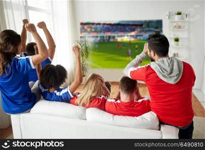 sport, leisure and entertainment concept - friends or football fans watching soccer on projector screen at home, one team wins another loses. friends or football fans watching soccer. friends or football fans watching soccer