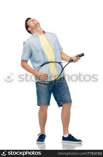 sport, leisure and people concept - happy young man playing tennis racket as imaginary guitar over white background. happy young man playing tennis racket as guitar