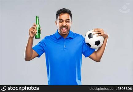 sport, leisure games and success concept - happy indian man or football fan with soccer ball and beer bottle celebrating victory over grey background. football fan with soccer ball celebrating victory