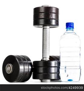 sport nutrition. metal barbells with bottle of water
