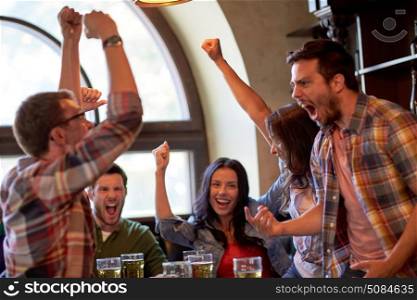 sport, people, leisure, friendship and entertainment concept - happy football fans or friends drinking beer and celebrating victory at bar or pub. football fans or friends with beer at sport bar. football fans or friends with beer at sport bar