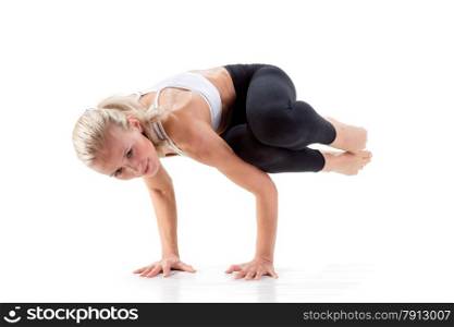 Sport Series: Young Beautiful Woman doing Yoga. Sideways Crow Posture