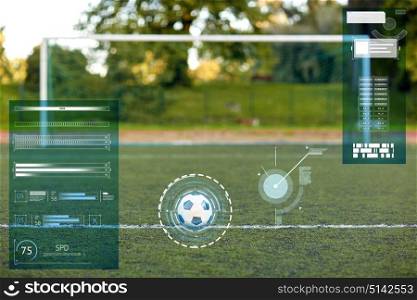 sport, soccer and technology concept - ball and goal on football field. soccer ball and goal on football field