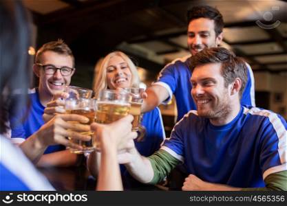 sport, soccer, people and leisure concept - happy friends or football fans clinking beer glasses and celebrating victory at bar or pub