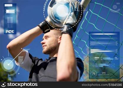 sport, technology and people concept - soccer player or goalkeeper with ball at goal on football field. goalkeeper with ball at football goal on field