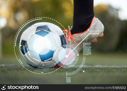 sport, technology and people concept - soccer player playing with ball on football field. soccer player playing with ball on football field