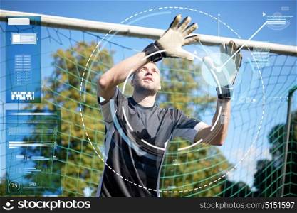 sport, technology and people - soccer player or goalkeeper at football goal on field. goalkeeper or soccer player at football goal