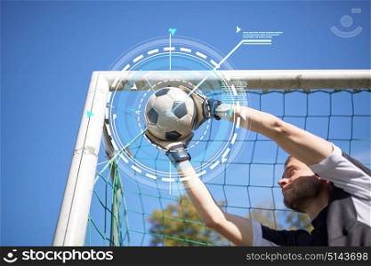 sport, technology and people - soccer player or goalkeeper catching ball at football goal on field. goalkeeper with ball at football goal on field