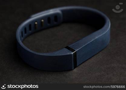 sport, technology, game and objects concept - close up of heart rate watch band
