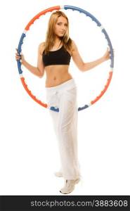 Sport training gym and lifestyle concept. Full length sporty girl doing exercise with hula hoop. Fitness woman isolated on white