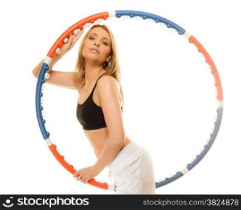 Sport training gym and lifestyle concept. Sporty girl doing exercise with hula hoop. Fitness woman isolated on white