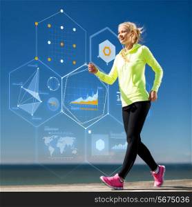 sport, training, technology and lifestyle concept - smiling young woman running outdoors