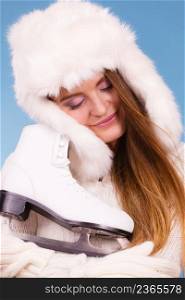 Sport, winter, people concept. Beautiful lady is huging white skate. Winter scenery. . Winter scenery with beautiful girl.