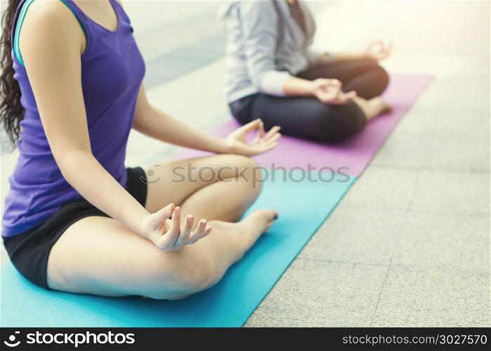 Sport woman doing meditation yoga pose on mat at home. Picture f. Sport woman doing meditation yoga pose on mat at home. Picture for add text message. Backdrop for design art work.