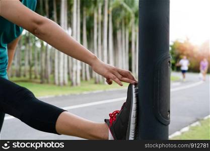 sport woman is stretching muscle before workout