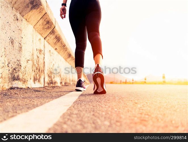 sport woman walking towards on the road side. Step concept