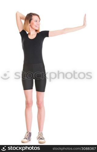 Sport Young woman in black doing exercise gymnastic pose isolated on white