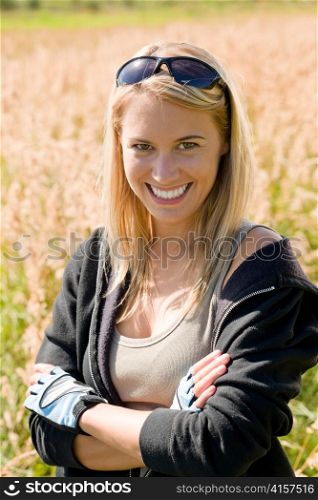 Sportive biking young attractive woman portrait sunny countryside