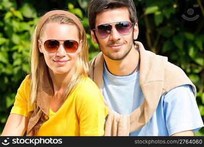 Sportive young couple portrait wear sunglasses outside sunny day