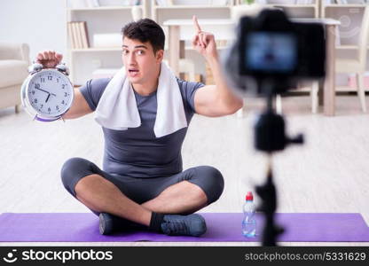 Sports and health blogger recording video in sport concept