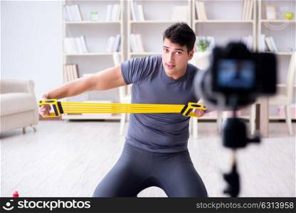Sports and health blogger recording video in sport concept