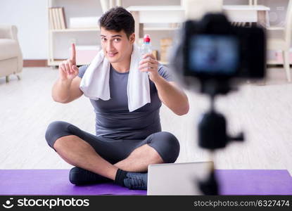 Sports and health blogger recording video in sport concept