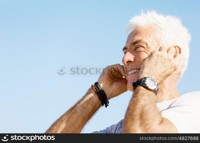 Sports and music. man getting ready for jogging. Sports and music. man getting ready for jogging and listening to the MP3 player