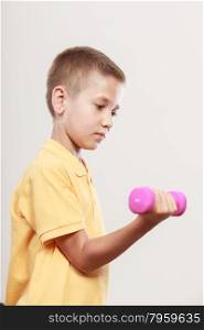 Sports boy making exercise with dumbbell. Care about health and body