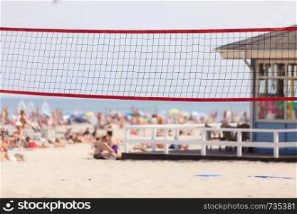 Sports during summer ideas concept. Volleyball net on sandy beach, sunny summertime day.. Volleyball net on sandy beach, summertime play